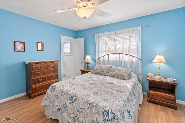 bedroom with ceiling fan and light hardwood / wood-style flooring