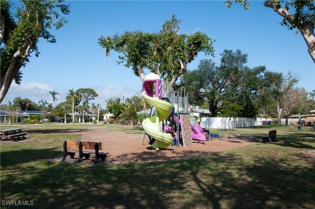 view of jungle gym featuring a lawn