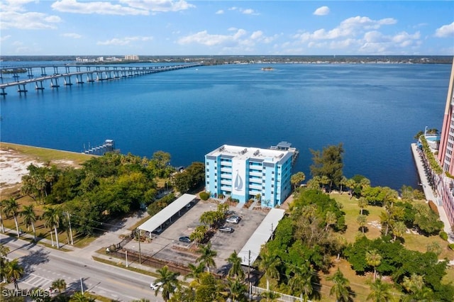 birds eye view of property with a water view