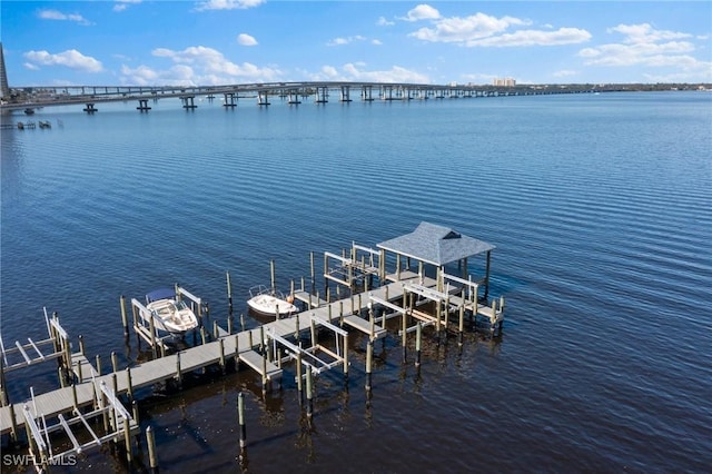 view of dock featuring a water view and boat lift