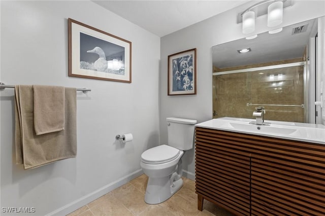 bathroom featuring baseboards, tiled shower, toilet, tile patterned flooring, and vanity