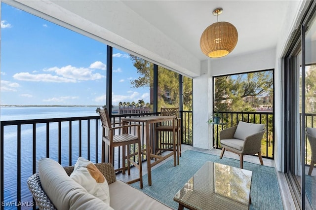 2711 1st St Unit 304, Fort Myers, FL 33916 - sunroom / solarium featuring a water view and wood finished floors