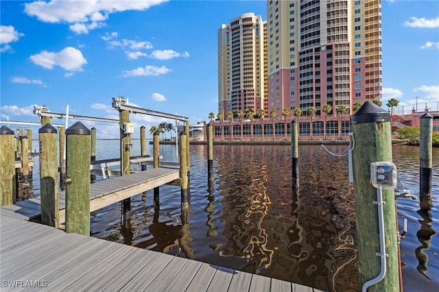 view of dock featuring a water view and boat lift