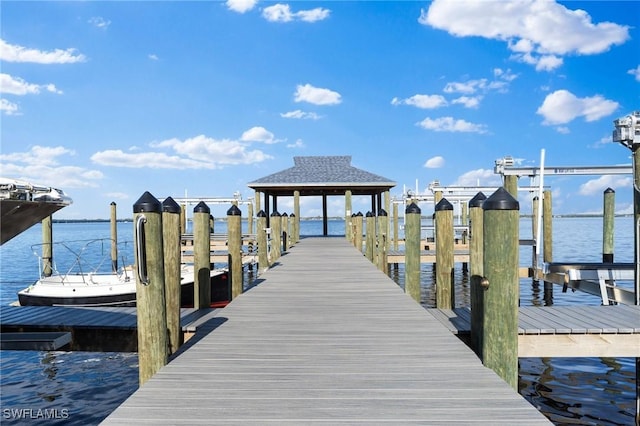 dock area featuring a water view and boat lift