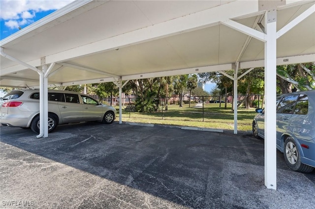 covered parking lot with fence