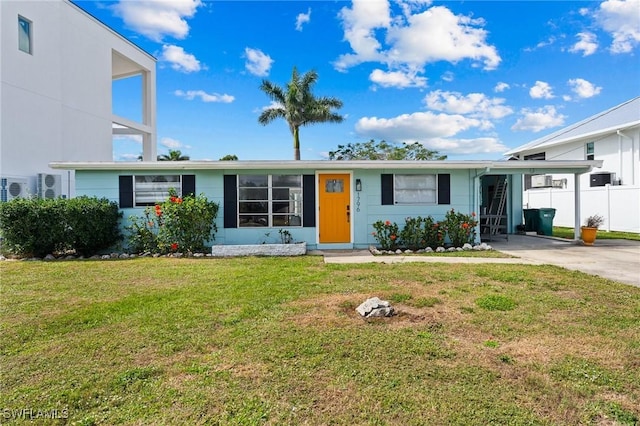 ranch-style house with ac unit, a front yard, and a carport