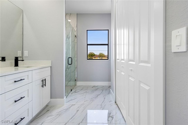 bathroom with vanity and an enclosed shower