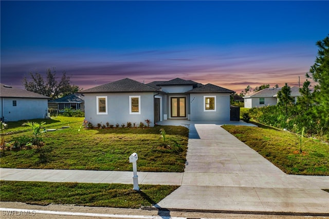 view of front of home with a yard