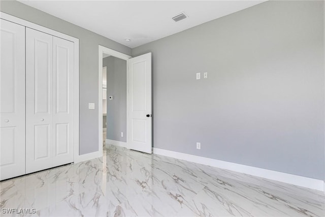 unfurnished bedroom with a closet