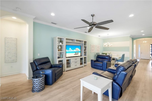 living room featuring crown molding, ceiling fan with notable chandelier, and light hardwood / wood-style floors