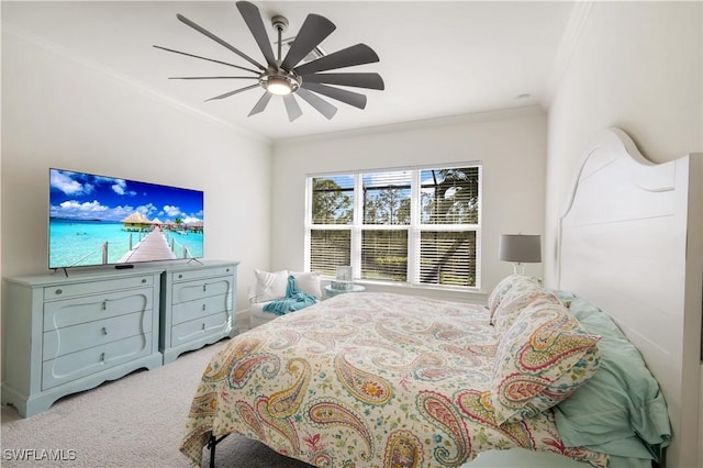 bedroom featuring crown molding, ceiling fan, and carpet