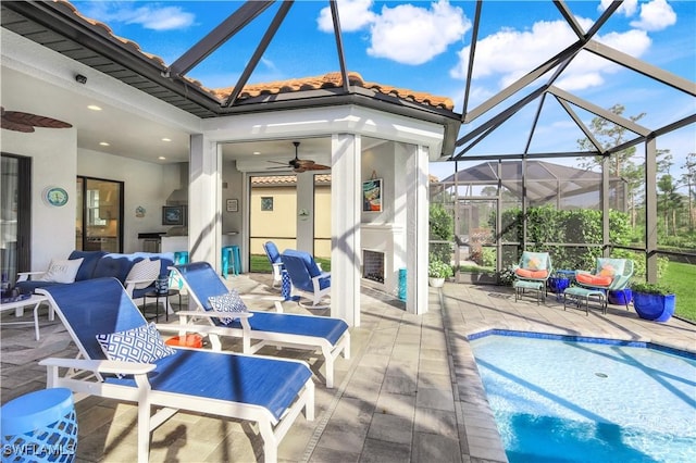 view of patio / terrace featuring an outdoor living space, a lanai, and ceiling fan