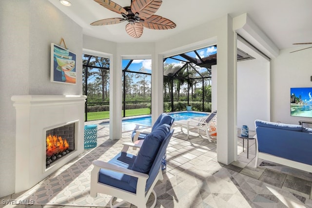 interior space featuring a pool, ceiling fan, and a fireplace