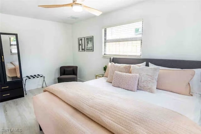 bedroom featuring a ceiling fan and wood finished floors