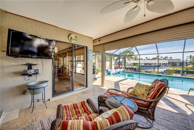 view of swimming pool featuring ceiling fan