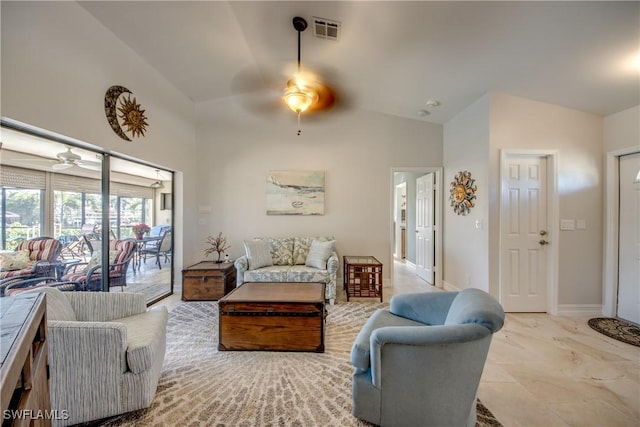 living room featuring ceiling fan and high vaulted ceiling