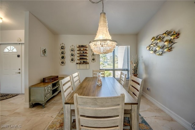 dining area featuring a chandelier