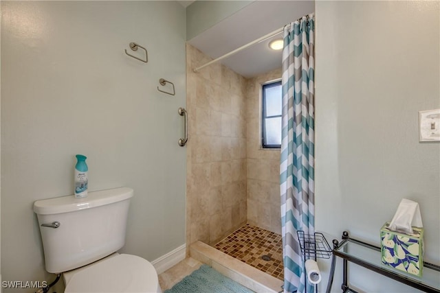 bathroom with toilet and walk in shower