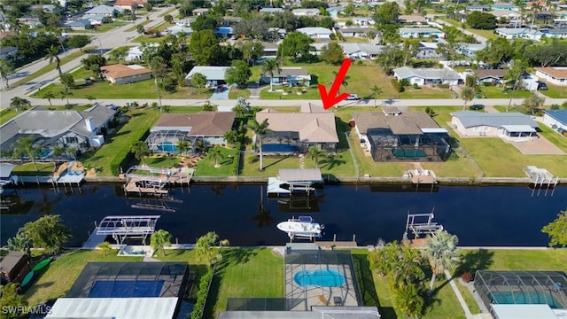 birds eye view of property featuring a water view