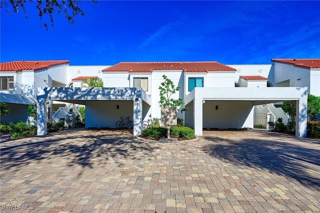 mediterranean / spanish-style house featuring a carport