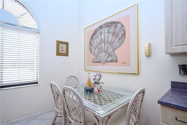 dining area with light tile patterned flooring