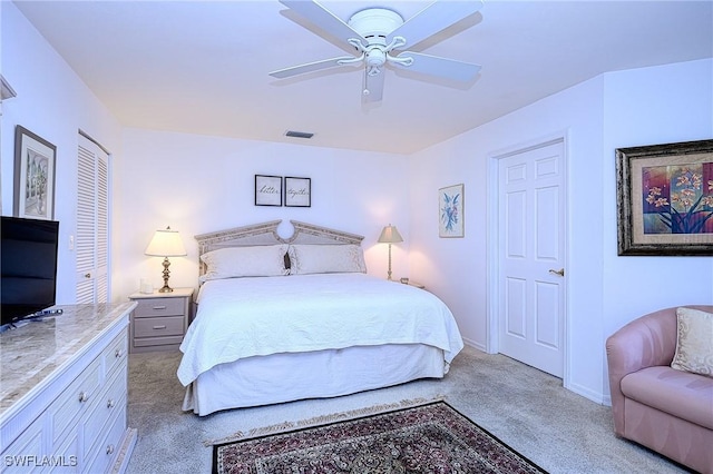 carpeted bedroom with ceiling fan