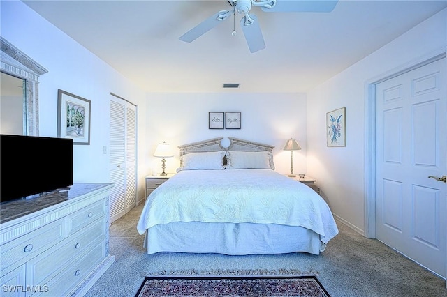 bedroom with light carpet, ceiling fan, and a closet