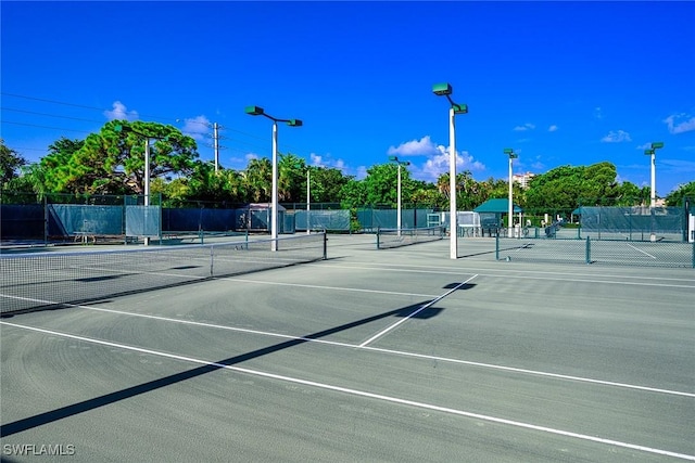 view of sport court featuring basketball hoop