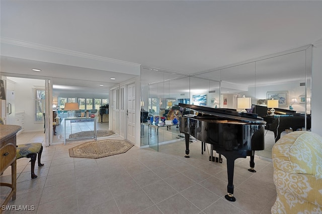 miscellaneous room featuring light tile patterned floors and crown molding