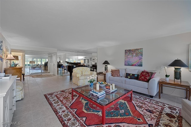 living room with light tile patterned floors and ornamental molding