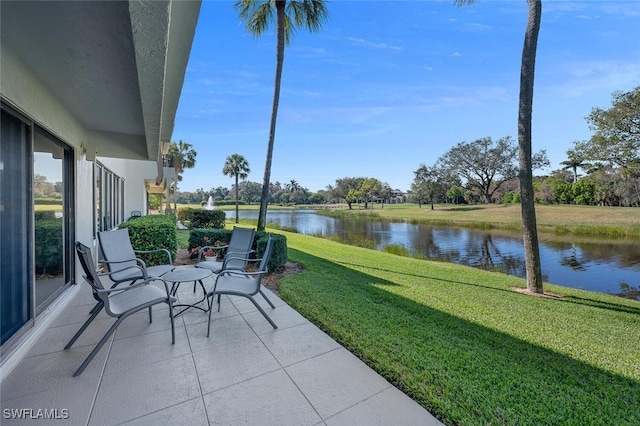 unfurnished sunroom with a water view