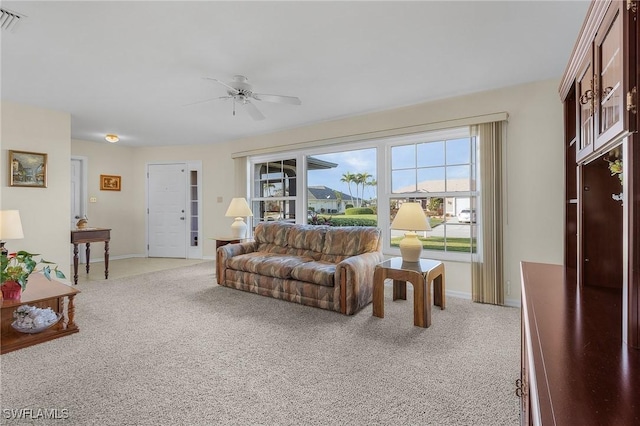 living room with ceiling fan and carpet floors