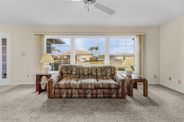 living room featuring carpet floors and ceiling fan