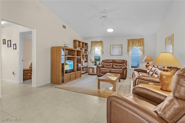 living room with ceiling fan and vaulted ceiling