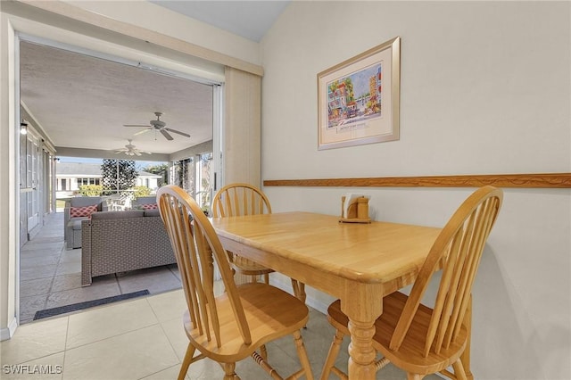 tiled dining area with ceiling fan