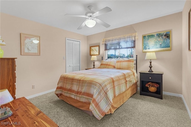 carpeted bedroom with a closet and ceiling fan