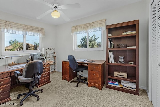 home office with light colored carpet and ceiling fan