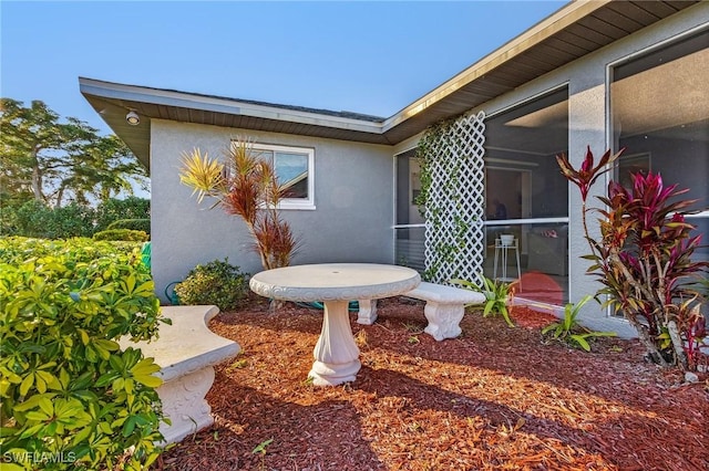 exterior space featuring a sunroom