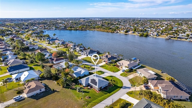 birds eye view of property featuring a water view