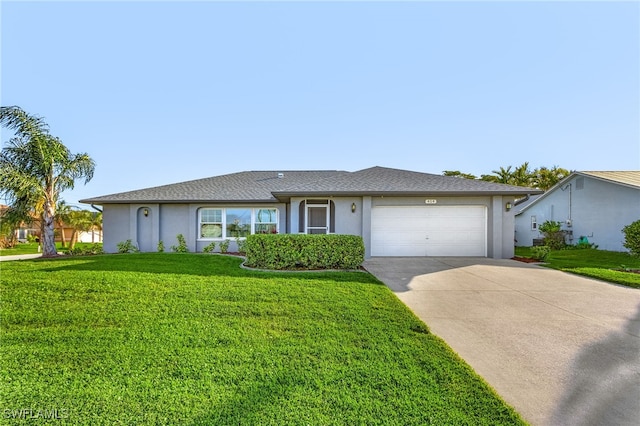 single story home featuring a garage and a front lawn