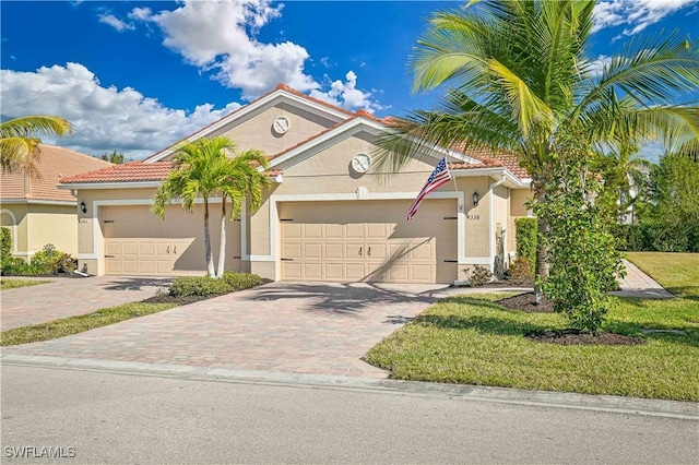 4338 Dutchess Park Rd, Fort Myers, FL 33916 - view of front facade with a garage, stucco siding, decorative driveway, and a tile roof