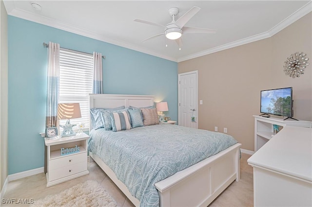 tiled bedroom with ornamental molding and ceiling fan