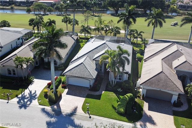 birds eye view of property with a water view