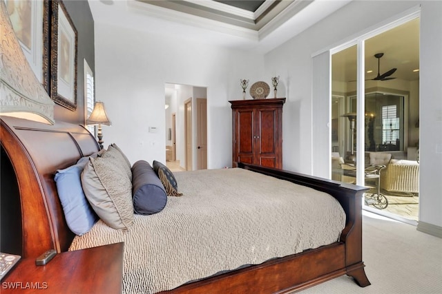 carpeted bedroom with crown molding and ensuite bathroom