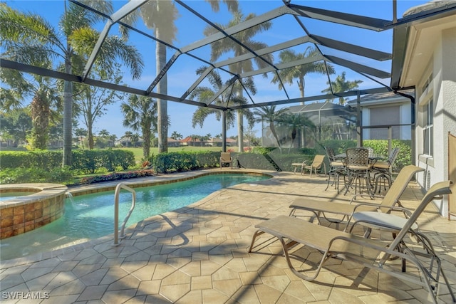 view of pool featuring a lanai, a patio, and an in ground hot tub