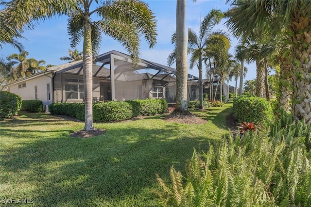 view of yard featuring a lanai