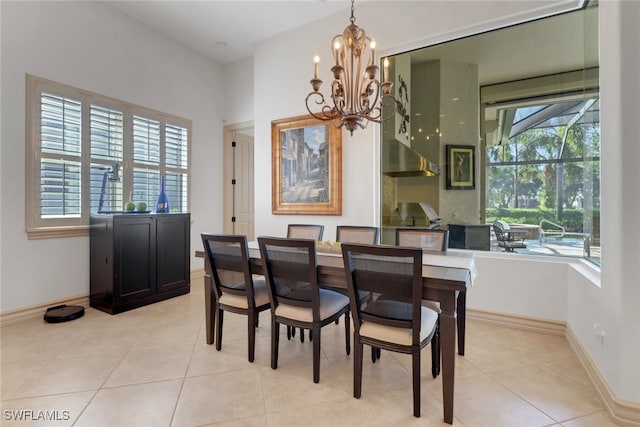 dining room with a notable chandelier and light tile patterned flooring