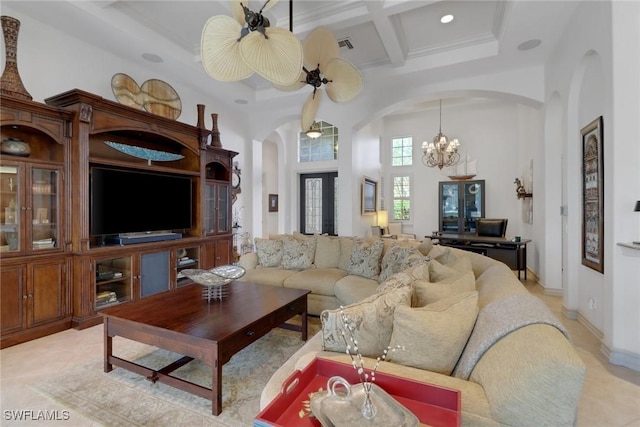 tiled living room featuring coffered ceiling, a notable chandelier, a towering ceiling, and beamed ceiling