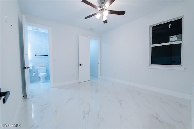 unfurnished bedroom featuring ceiling fan and ensuite bath