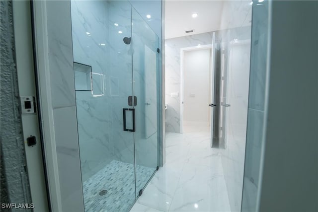 bathroom with an enclosed shower